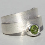 Art.-Nr. Ca-RS1606P Silberring mit Peridot | Helix, 5 mm fac. Peridot, 84,90€