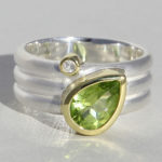 Art.-Nr. Ca-RS1721PB Silberring vergoldet mit Peridot und Bergkristall, Stein: 6,5x9,5mm und 2mm, 150,00€